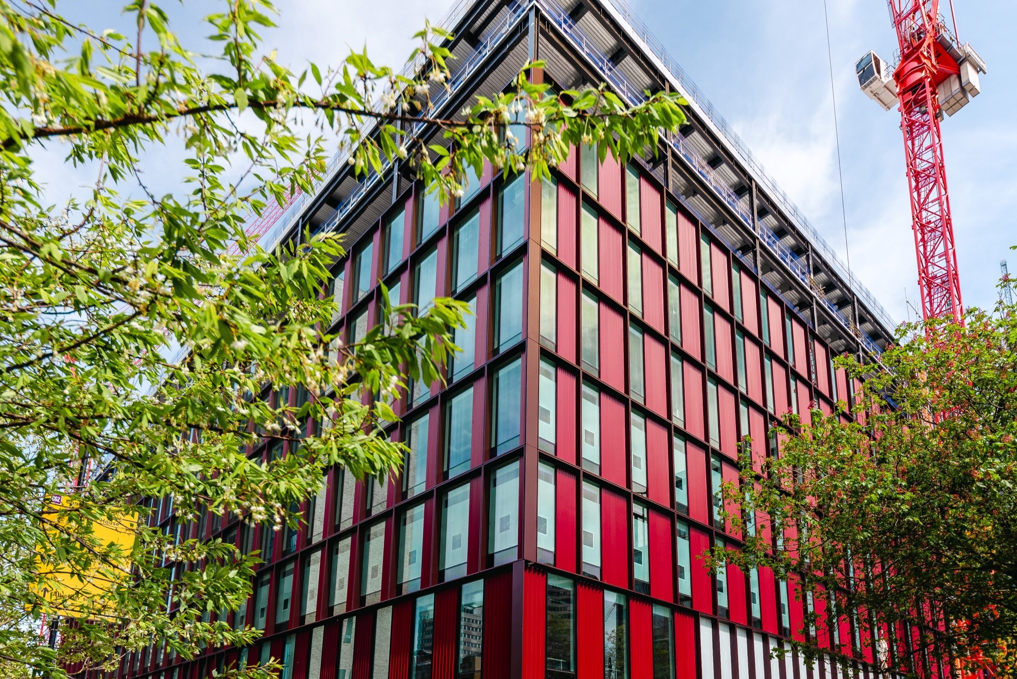 Our Government Hub at 2 Ruskin Square in Croydon, London, generates solar gain through the building facades. These are panels of glass placed vertically up the sides of the building which are separated by red vertical panels.