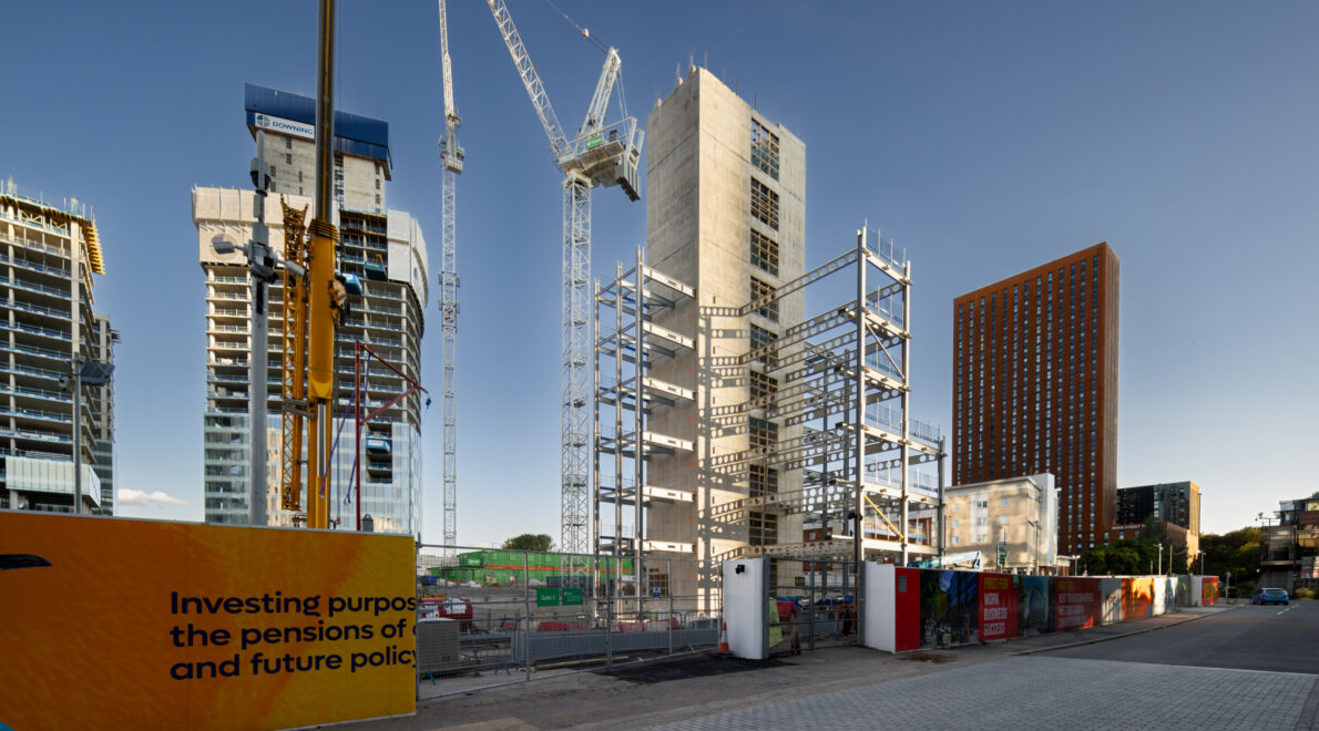 Construction of First Street - showing building being erected, and a crane.