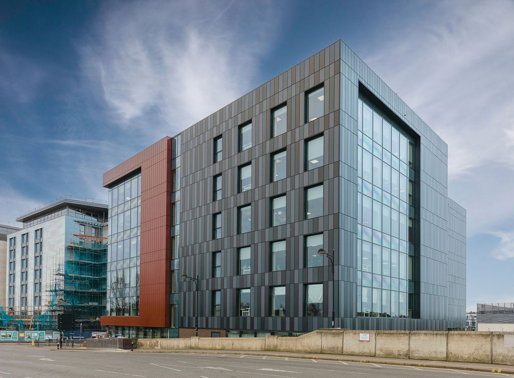 External view of building, large rectangle share with grey and red exterior