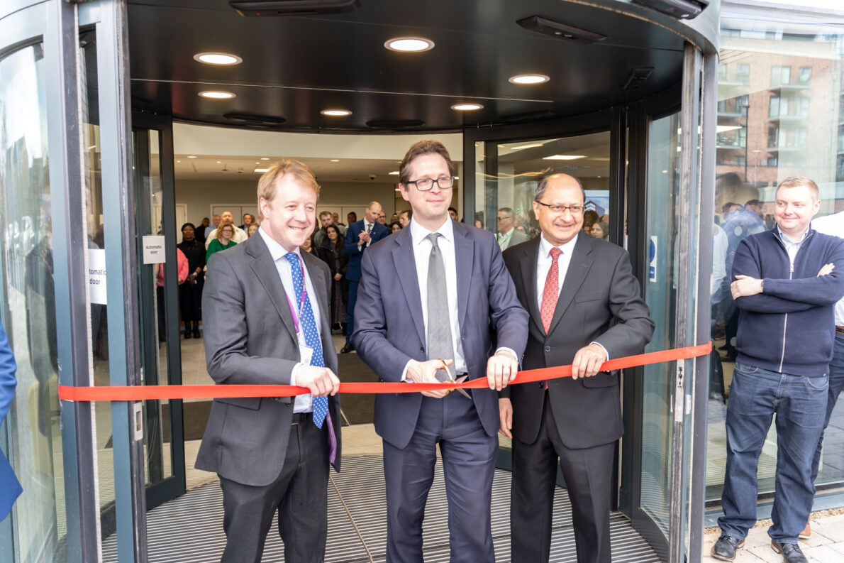 Cabinet Office Minister Alex Burghart cutting the red ribbon at the official opening of Quay House.